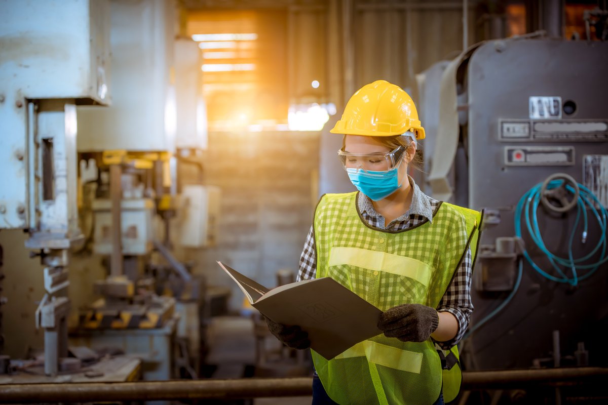 Field worker logging an entry in an industrial facility